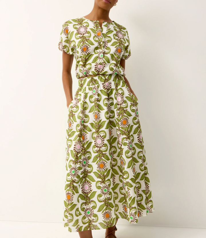 Woman wearing a floral dress with a white background