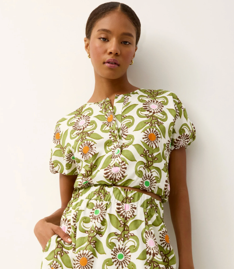 Woman wearing a floral dress with a white background