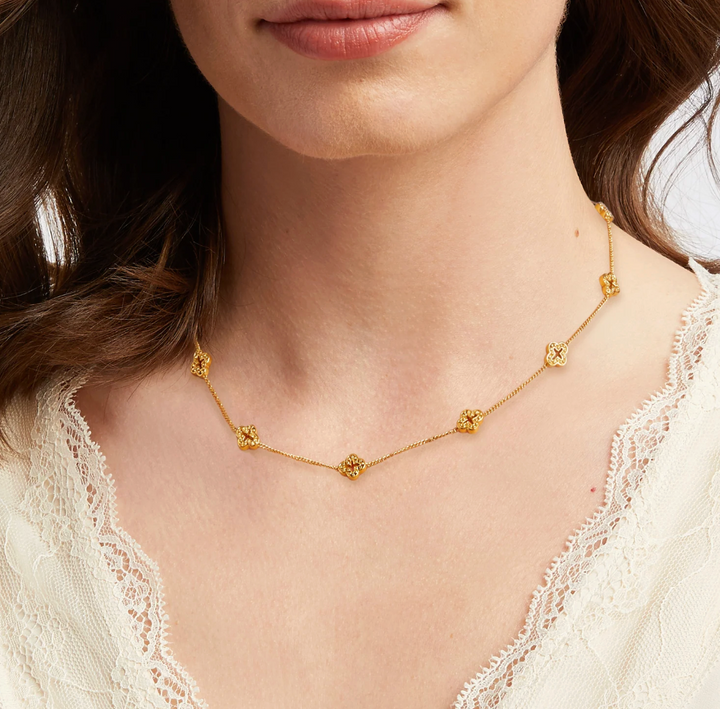 Julie Vos Florentine Demi Delicate Station Necklace, on-model close-up worn at the neckline, showing floral station spacing and chain detail against skin.