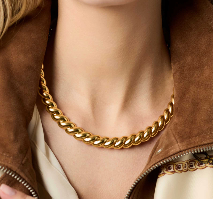 Julie Vos Ravello Collar Necklace, on-model close-up worn as a collar at the neckline against suede jacket.