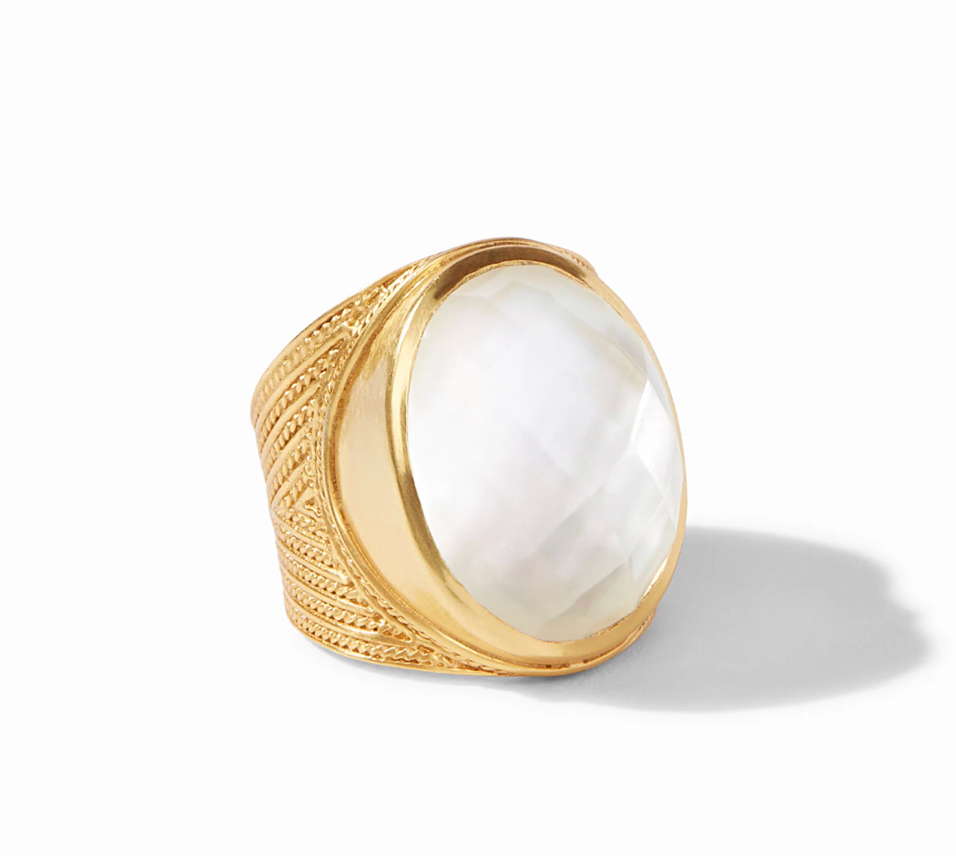 Julie Vos Verona Statement Ring in 24K gold plate — wide chevron-etched band with large oval faceted clear crystal glass stone in bezel setting, on white background.