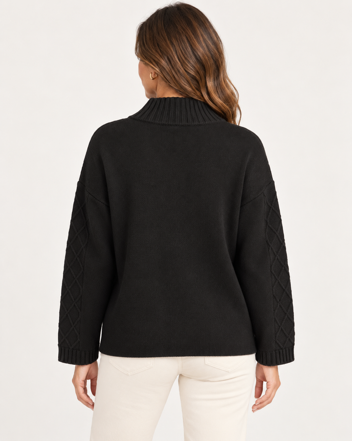 Elliott Lauren Knit Zip Up Sweater Jacket in Black, back view on model, showing the ribbed stand collar, dropped shoulders, diamond cable sleeve panels, and ribbed cuffs