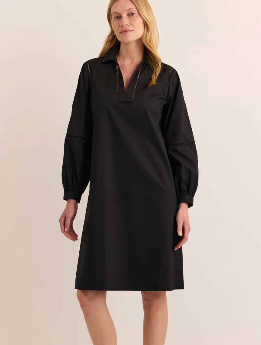Three-quarter front view of the Hinson Wu Laura Long Sleeve Lace Trim Dress in black, highlighting the relaxed A-line silhouette and lace-trimmed cuff detail.