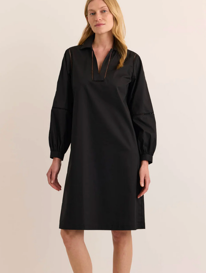 Three-quarter front view of the Hinson Wu Laura Long Sleeve Lace Trim Dress in black, highlighting the relaxed A-line silhouette and lace-trimmed cuff detail.