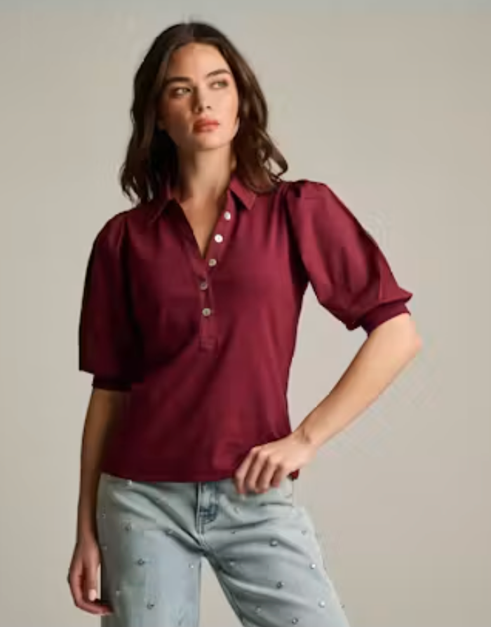 Lisa Todd Pure Rib Collet Top in Merlot — front view, model wearing top with collar and puff sleeves visible, styled with pearl-embellished light wash denim.