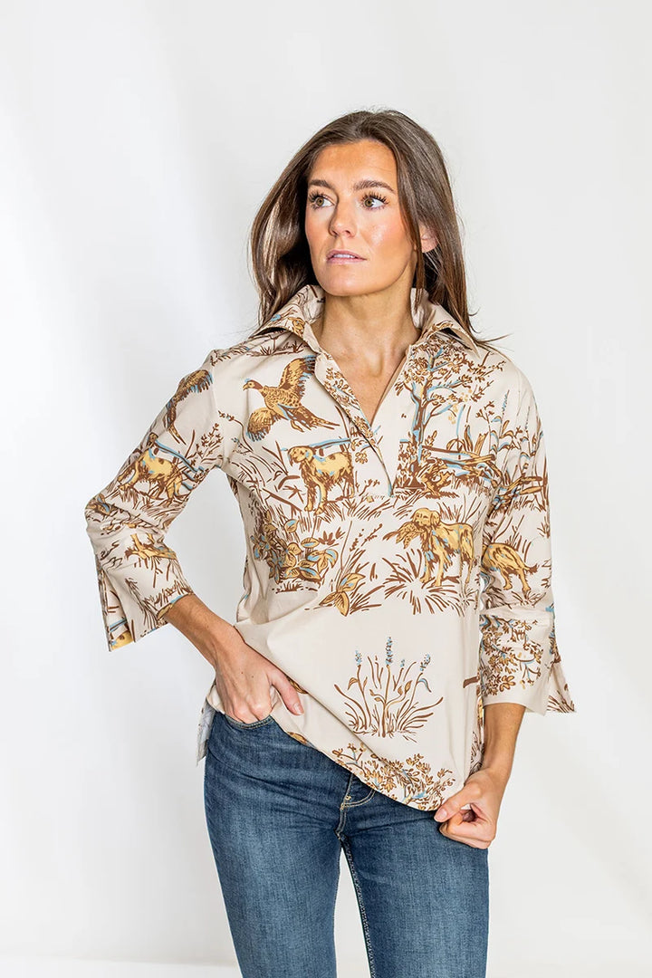 Front view, close-up collar detail: House of MBR Ruthie Top in Maple Field &amp; Feather© print, close crop with hands adjusting collar, showing crisp collar structure and pastoral print detail across the chest.