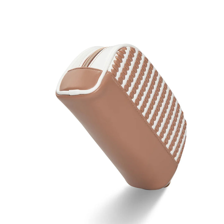 Side/end view: Stephanie Johnson Mae Mini Pouch in Marbella colorway, showing tapered end profile with woven caramel-and-white panel transitioning into solid tan side panel.