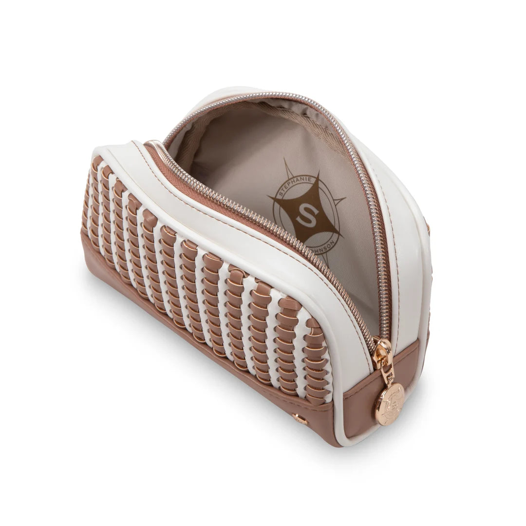 Open/angled view: Stephanie Johnson Mae Mini Pouch in Marbella colorway shown open, revealing soft tan interior lining with printed compass logo, alongside woven exterior panel and rose gold hardware.