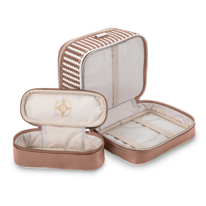 Flat lay with components: Stephanie Johnson Jenny Train Case shown open beside its two coordinating removable pouches, one displaying the brand&