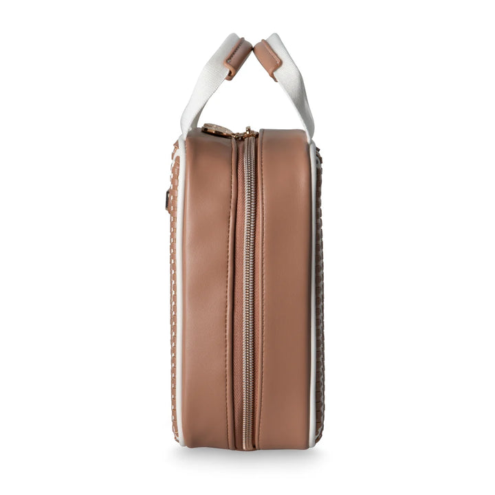 Side profile view: Stephanie Johnson Sasha Travel Bag in Marbella colorway, showing solid tan side panel, center zipper track, and canvas top handle with leather wrap.