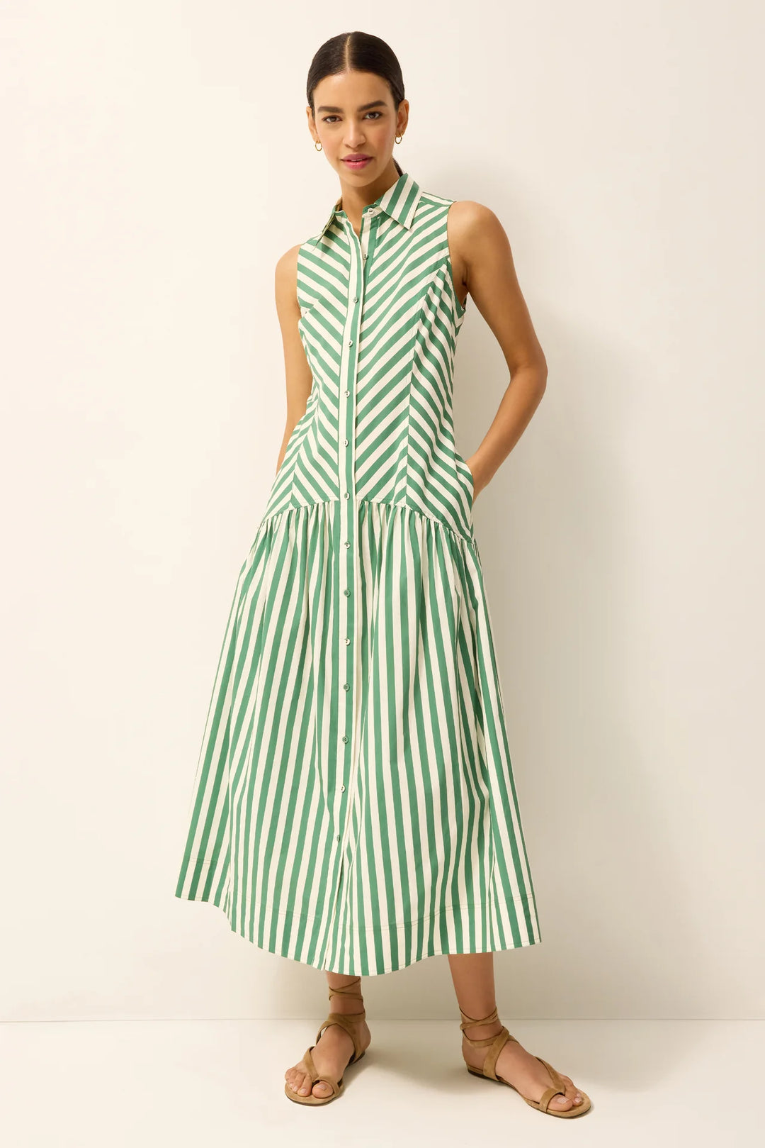 Marie Oliver Adalyn Dress in Verdure green stripe, sleeveless midi with collared neckline without belt, shown on model facing forward.