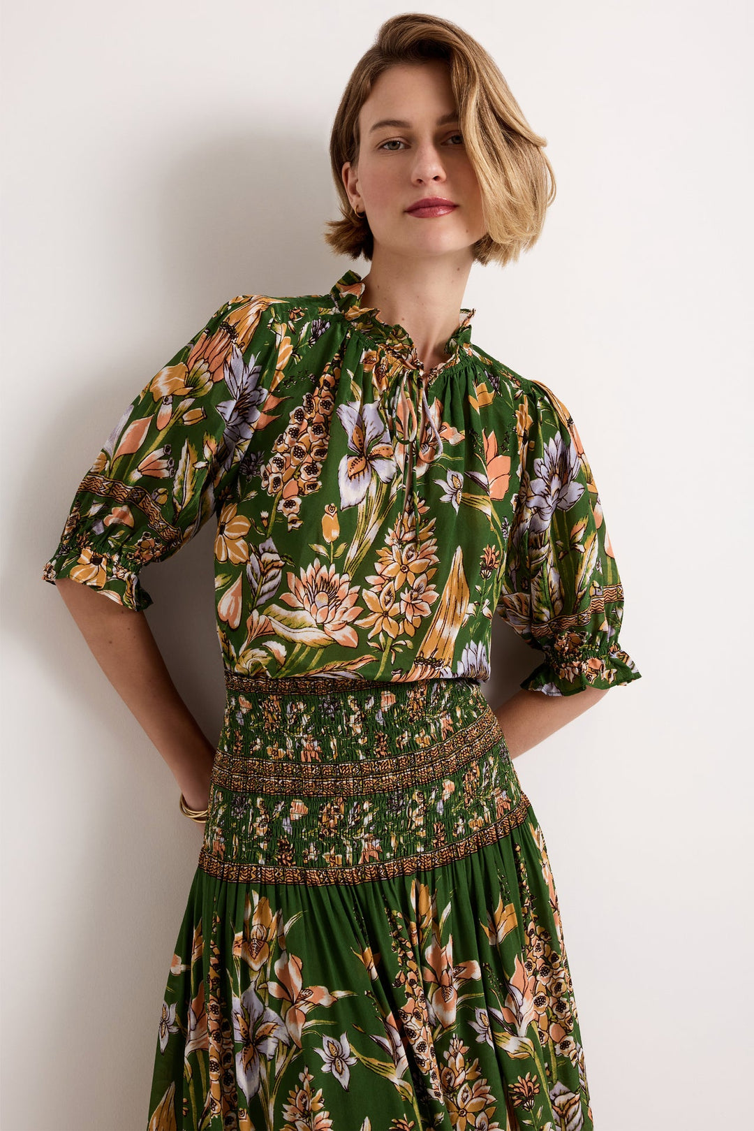 Marie Oliver Billie Blouse in Greenhouse — front detail view showing ruffled neckline, neck ties, and floral print