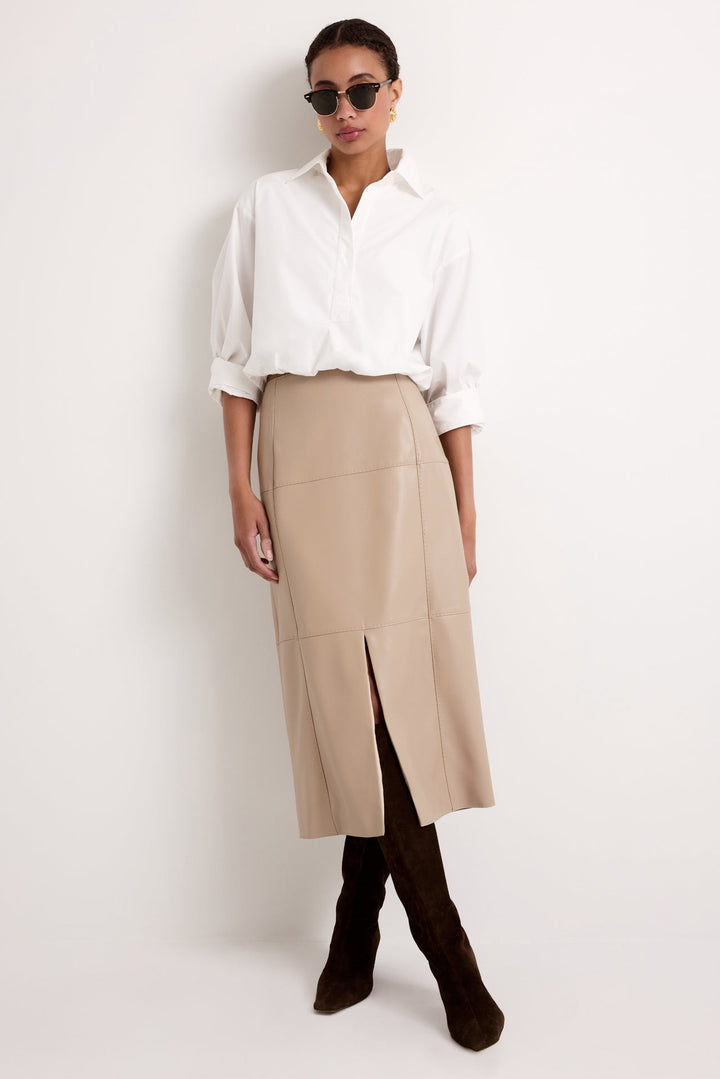 Marie Oliver Elliott Skirt in Oat — front view styled with white button-down and brown suede boots