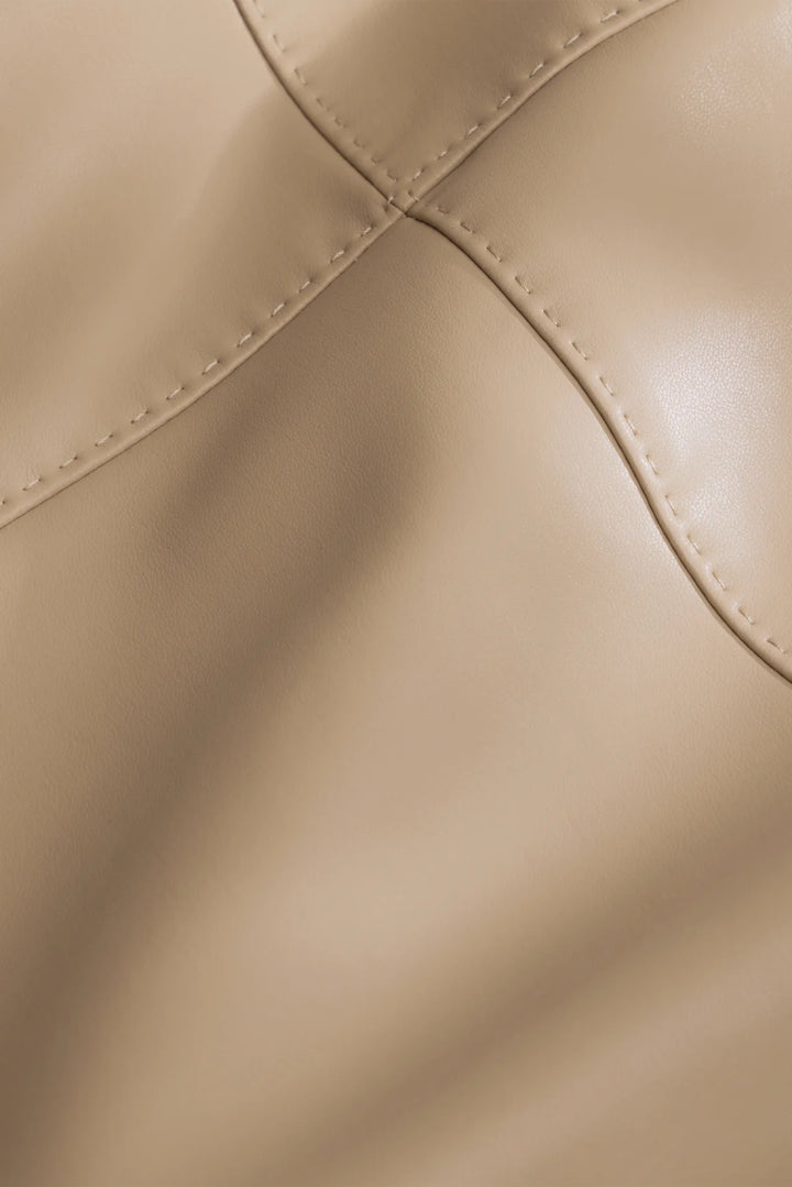 Marie Oliver Elliott Skirt in Oat — close-up detail of pick-stitched seams and vegan leather texture