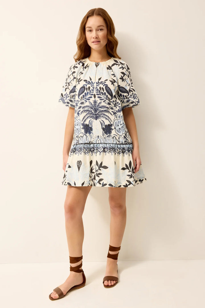 Marie Oliver Greta Dress in Tropica print, scoop neckline with bagged sleeves and drop-waist A-line silhouette, shown on model facing forward.