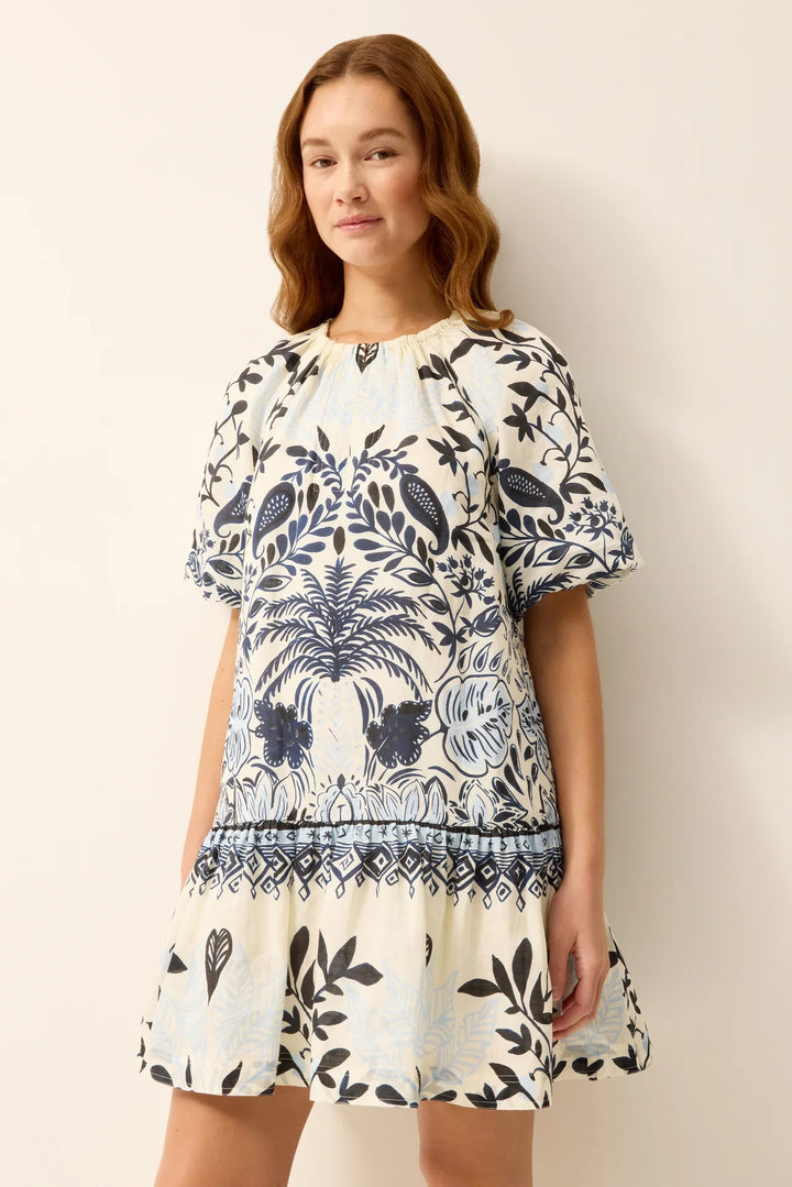 Close-up of Marie Oliver Greta Dress neckline and bodice, showing hook-and-eye closure and Tropica palm print detail.