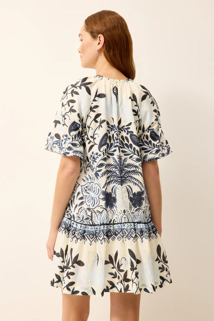 Marie Oliver Greta Dress, back view showing raglan seam construction and drop-waist A-line shape in Tropica print.