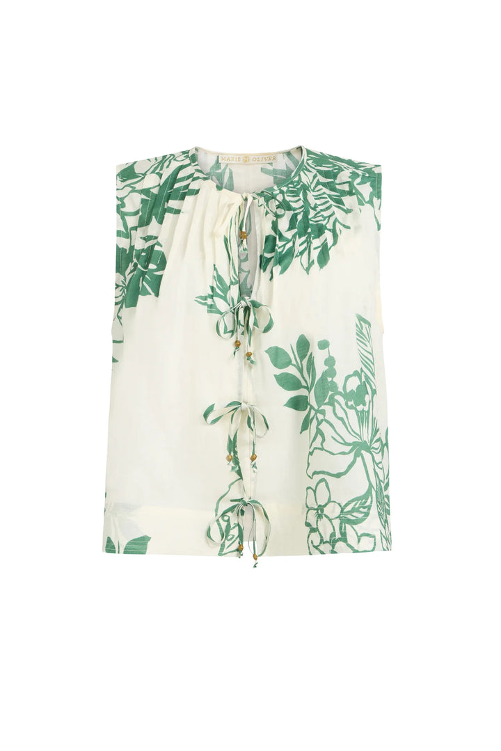 White blouse with green floral pattern on a white background