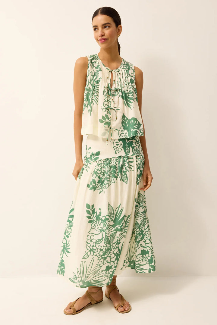 Marie Oliver Romina Top in green Garland print, A-line swing silhouette with front tie closures and round neckline, shown on model facing forward.