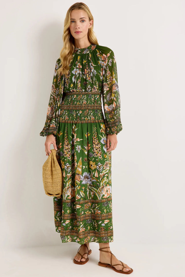 Marie Oliver Stacie Skirt, Greenhouse floral print, front view, model wearing full-length styled as a strapless dress with smocked waist panel and raffia tote.