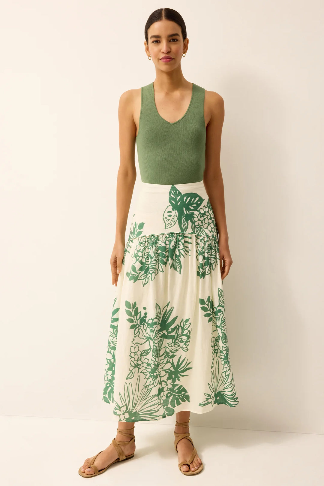Marie Oliver Vicki Garland Skirt in white and green print, curved drop-waist yoke with full swing midi silhouette, shown on model facing forward.