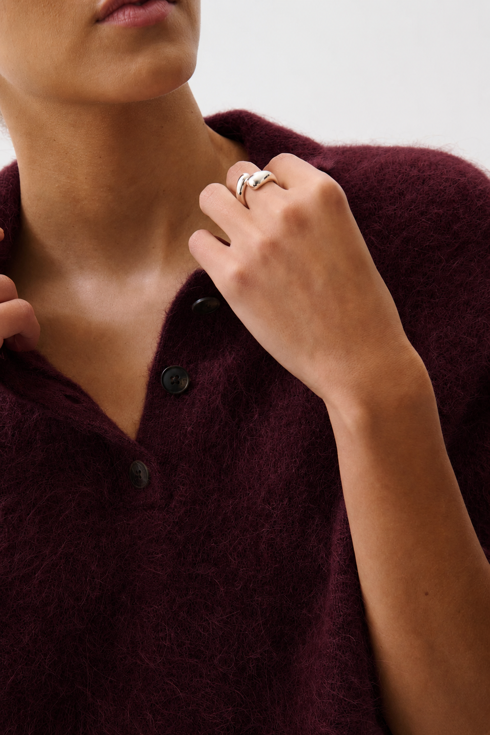 Pistola Nadya Alpaca Blend Boxy Polo Sweater in Cherry Wine, detail view, close-up of collar, button placket, and knit texture.