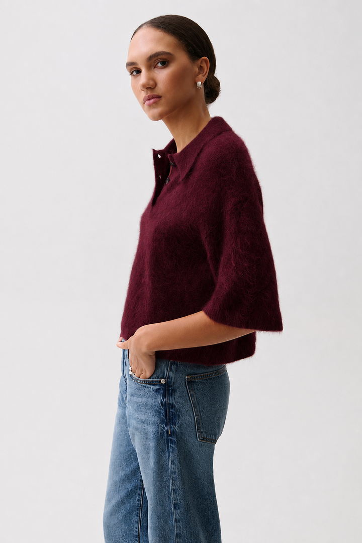 Pistola Nadya Alpaca Blend Boxy Polo Sweater in Cherry Wine, side profile view, showing boxy silhouette and elbow-length sleeve.
