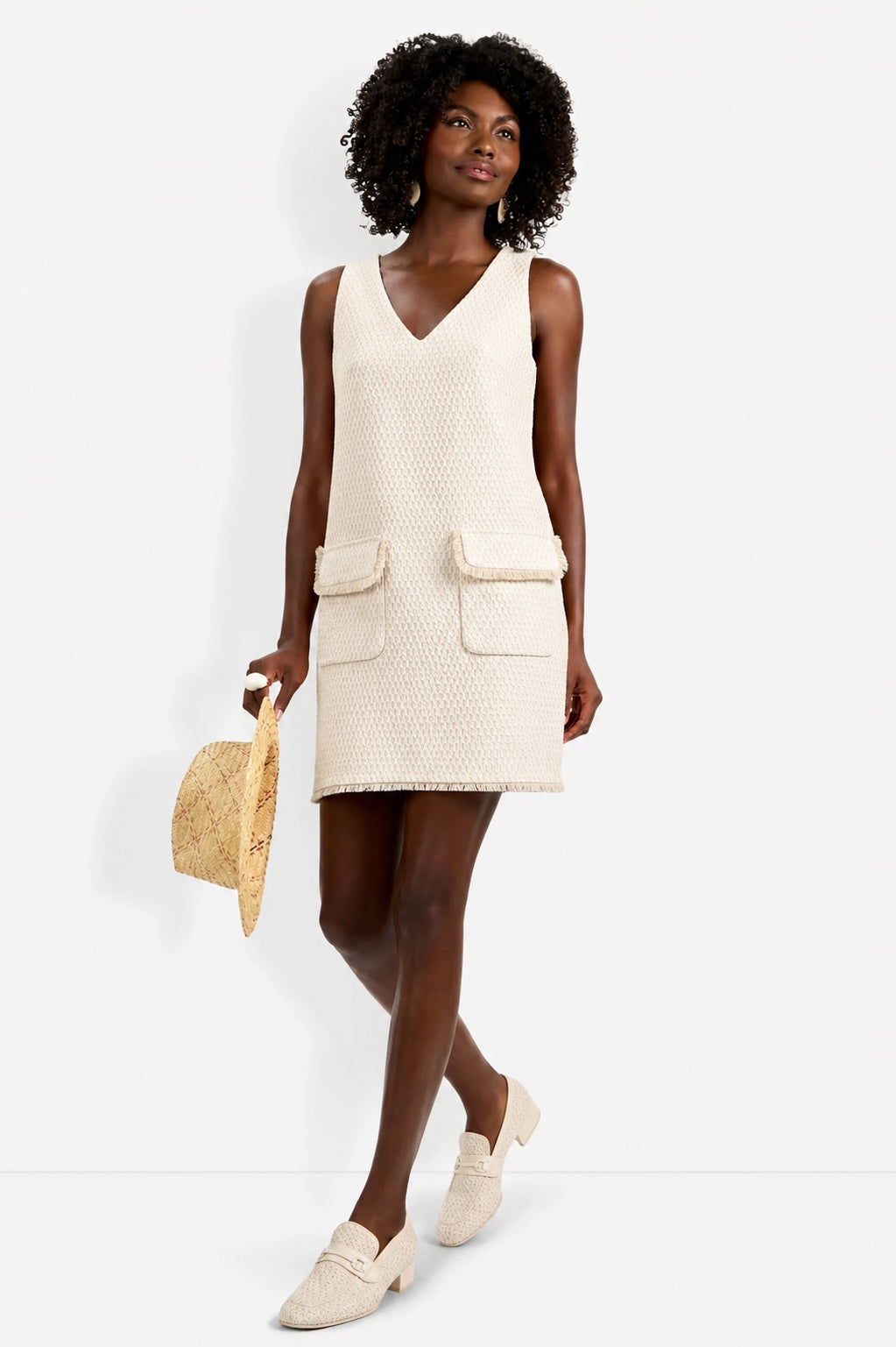 Front view of model wearing the Trina Turk Waveson Dress in Bonita Beige with a V-neckline and A-line skirt.