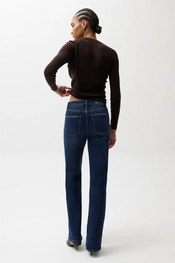 Pistola Evie High Rise Slim Boot Jean in Penthouse, dark indigo denim, back view with five-pocket detail and full-length bootcut silhouette, paired with fitted brown ribbed top