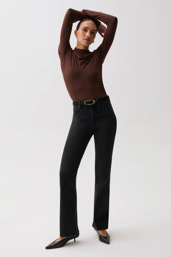 Pistola Evie High Rise Slim Boot in Jetset, full-length back view on model, showing back patch pockets, slim seat, and straight line into the boot flare.