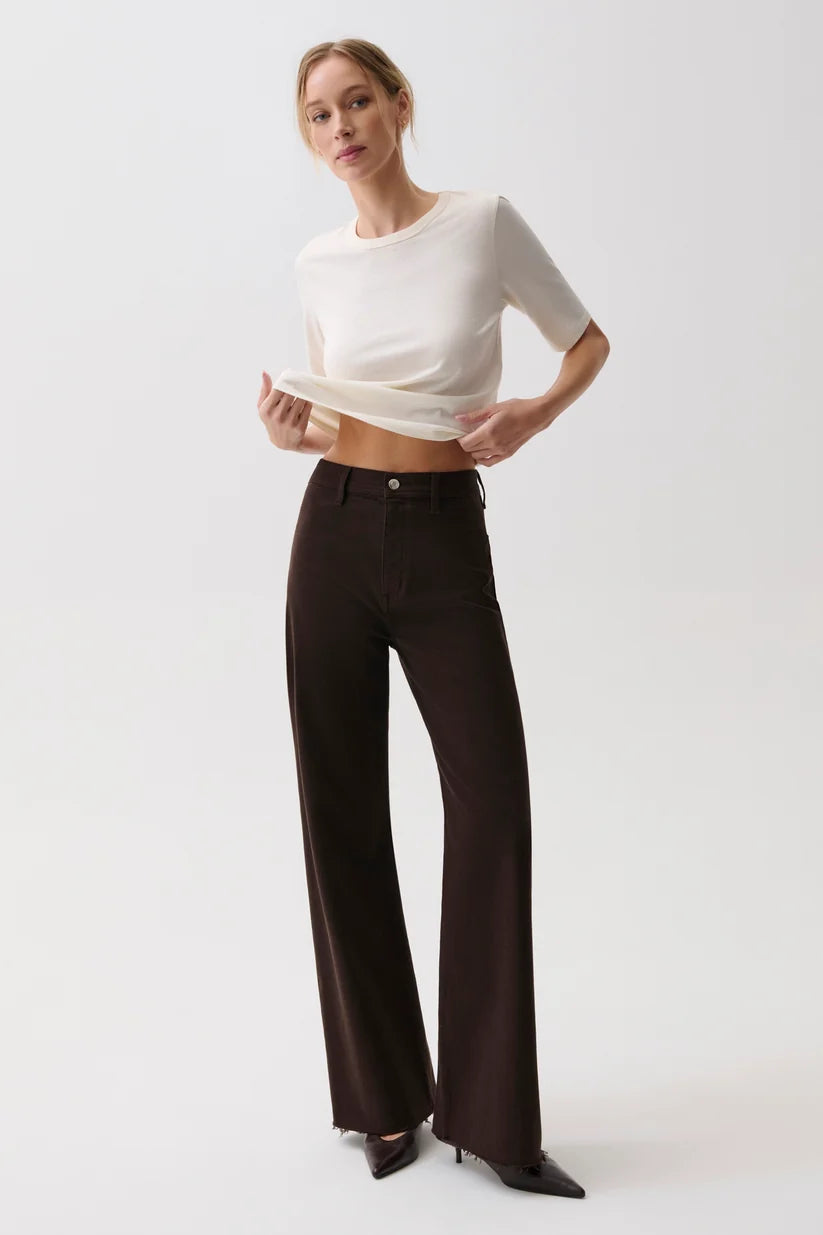 Pistola Penny High Rise Wide Leg Jean in Mocha, front view, model wearing brown wide-leg jeans with cream cropped top and heels.