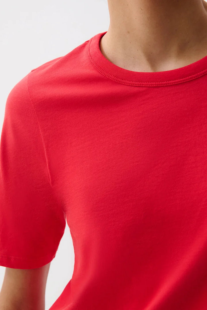 Pistola Melika Quarter Sleeve Crew Neck Tee Closeup in Negroni, front view, model wearing red crewneck tee with light wash jeans.