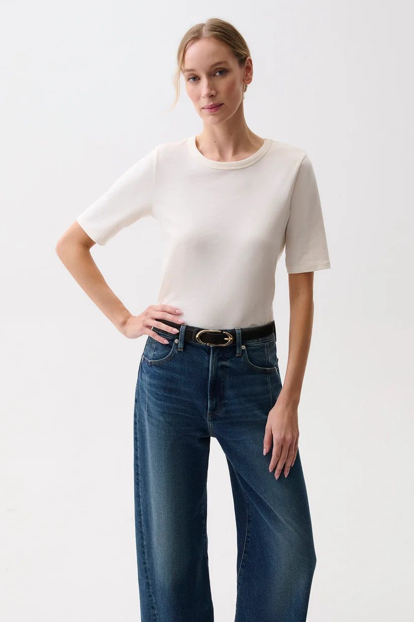 Pistola Melika Quarter Sleeve Crew Neck Tee in Soft White, front view, model wearing ivory crewneck tee with dark wash wide-leg jeans and belt.