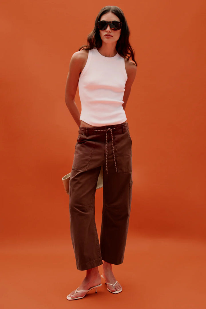Front on-model, styled — Pistola Sabrina Curved Utility Pants in Lindt, worn with white tank and heeled sandals
