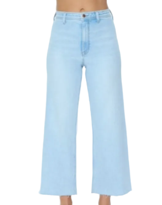 Light blue jeans worn by a person on a white background