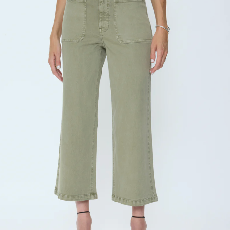 Person wearing olive green pants on a white background