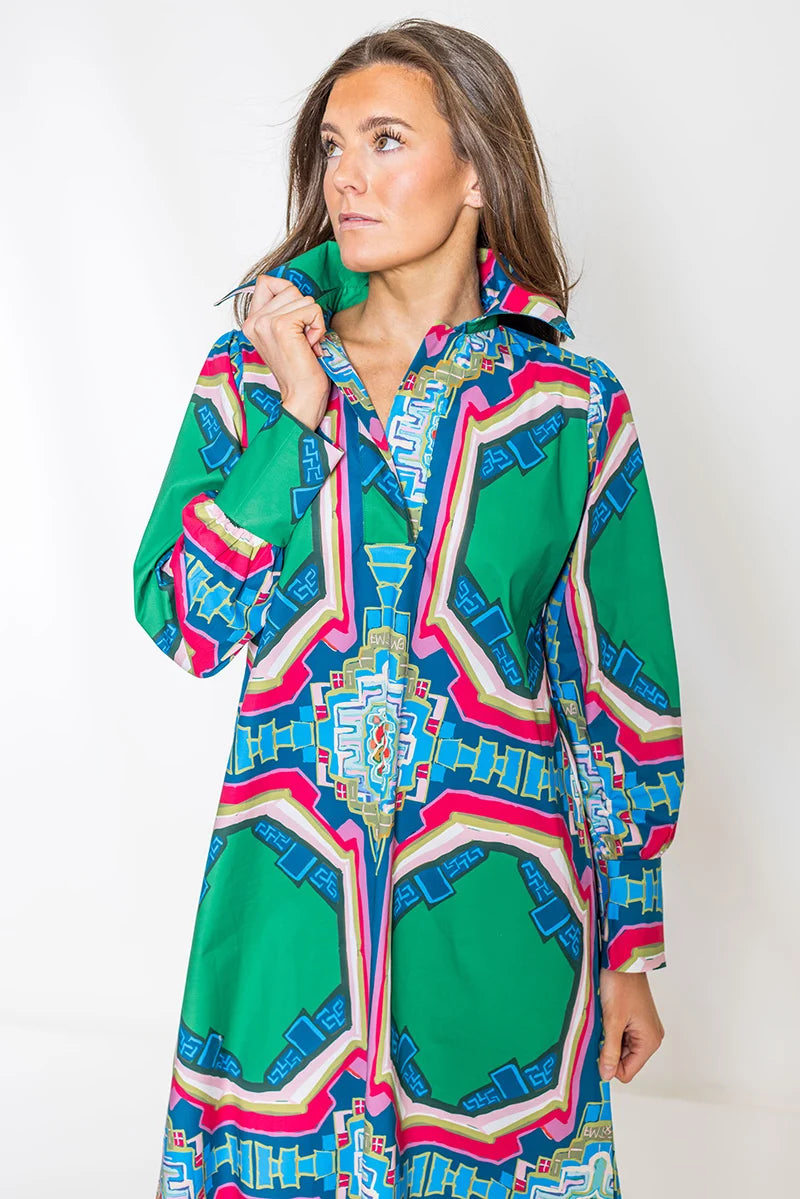 Close-up collar detail: House of MBR Diana Dress Long in Portico© print, close crop showing polished collar, button-front placket, and long sleeve with tailored cuff detail, hand adjusting collar.