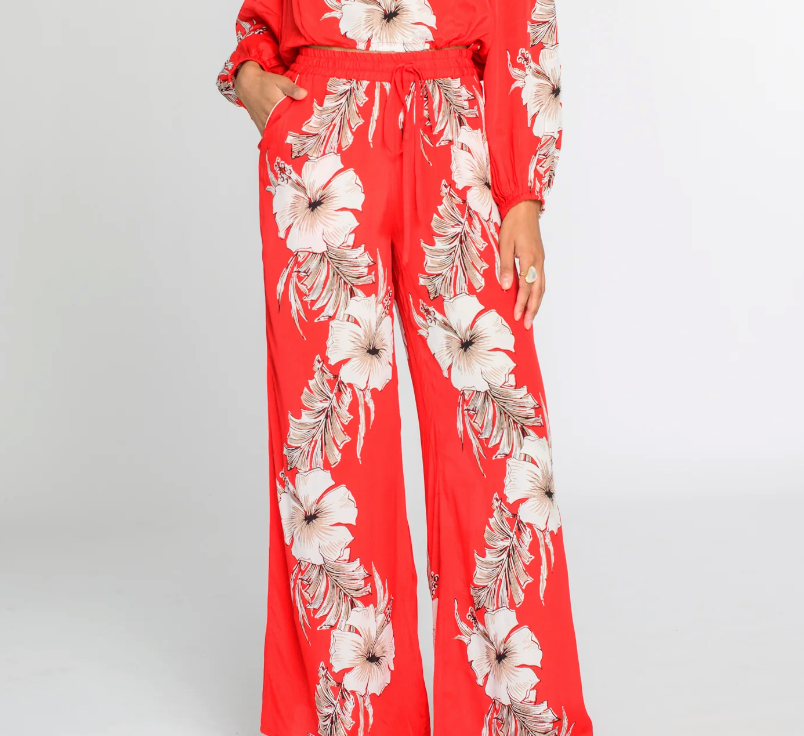 Red floral pants on a white background