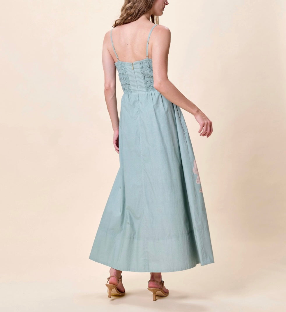 Back of Cleobella Riley Ankle Dress in Moresco Blue Surf, square neck with adjustable straps and large-scale orchid placement print