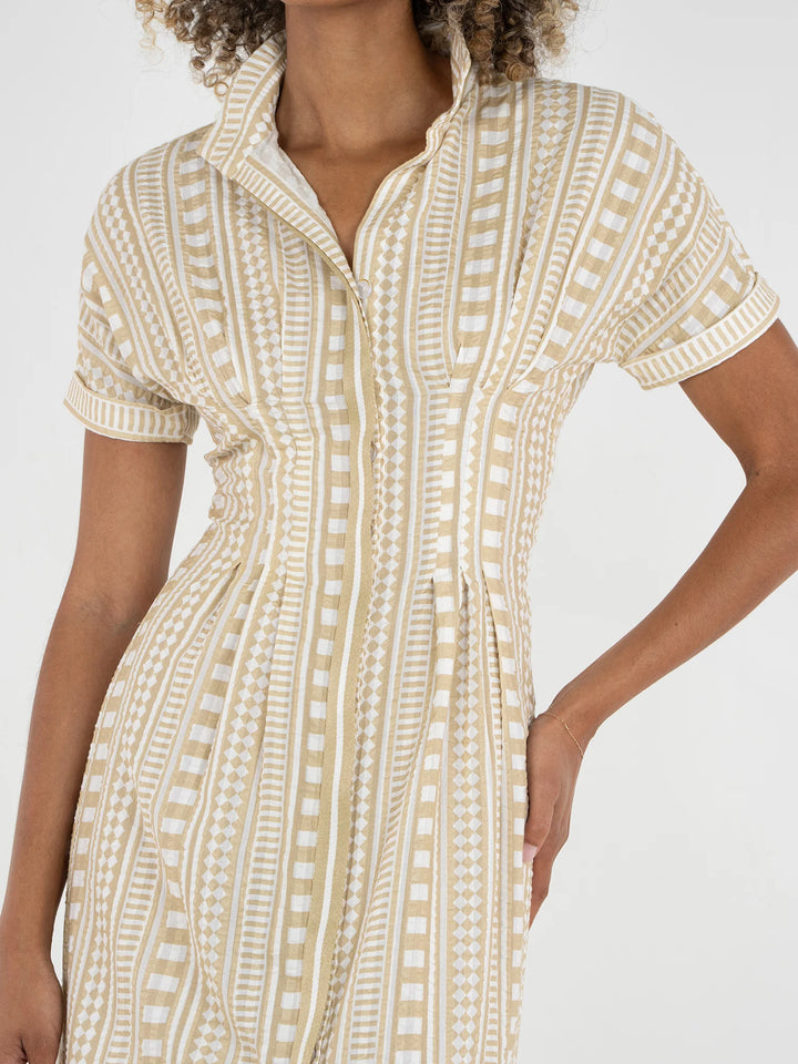 Close-up of Emily McCarthy Georgia Dress showing contrasting striped button placket, stand collar, and Piazza Stripe geometric motif on textured cotton.
