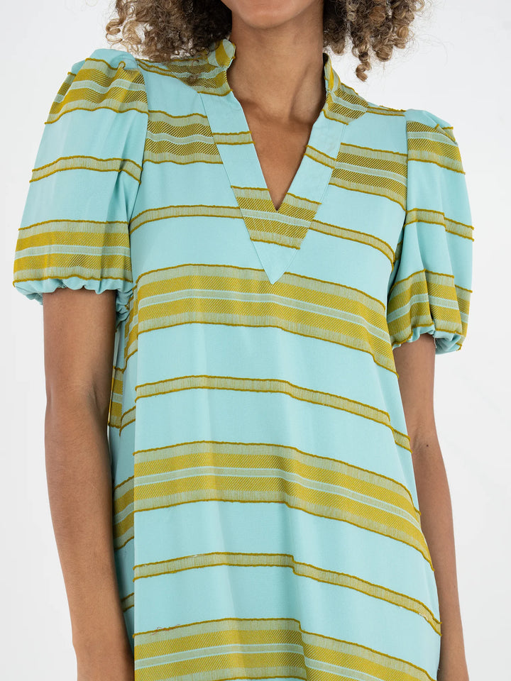 Close-up of fringe stripe print on Emily McCarthy Hampton Dress showing lightly frayed horizontal stripe texture and subtle dimensional surface effect.