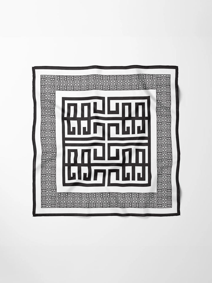 Emily McCarthy Hand-Stitched Silk Scarf in Black Greek Key — flat lay, full pattern and border visible