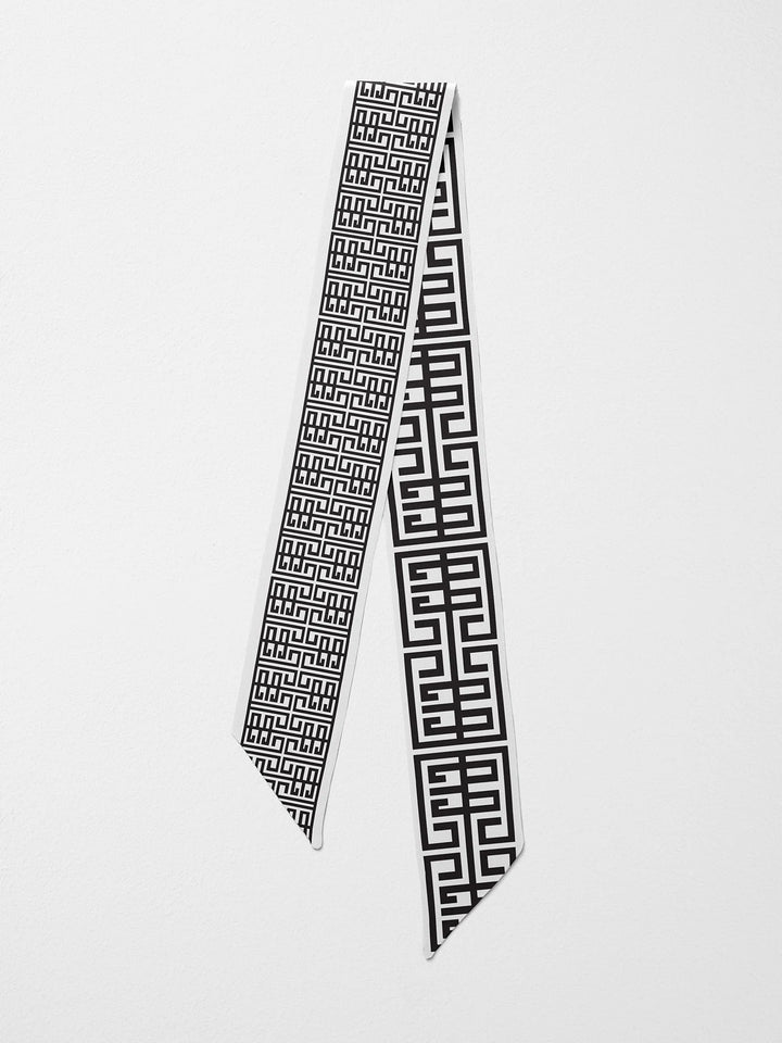 Emily McCarthy Silk Scarfette in Black Greek Key — flat lay, both reversible sides visible showing bold and refined pattern scales