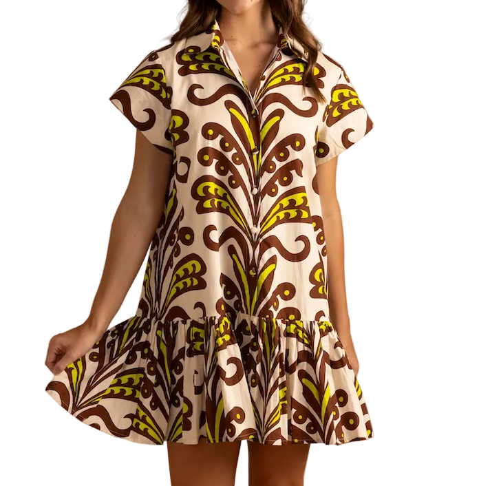 Woman wearing a patterned dress on a beige background