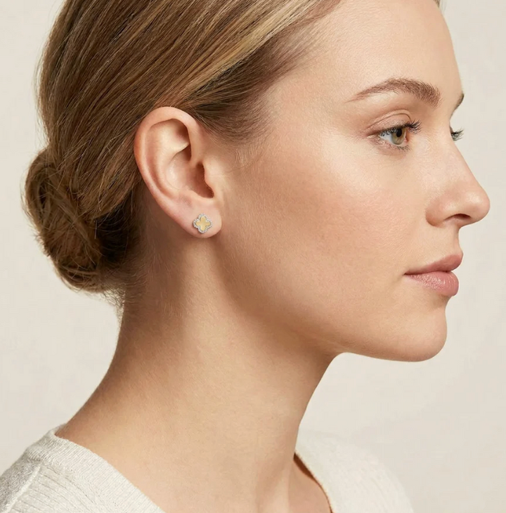 Ella Stein Classic Bloom Clover Stud Earrings in gold — side profile on model showing compact stud scale at lobe, clover silhouette, and diamond pavé border detail.