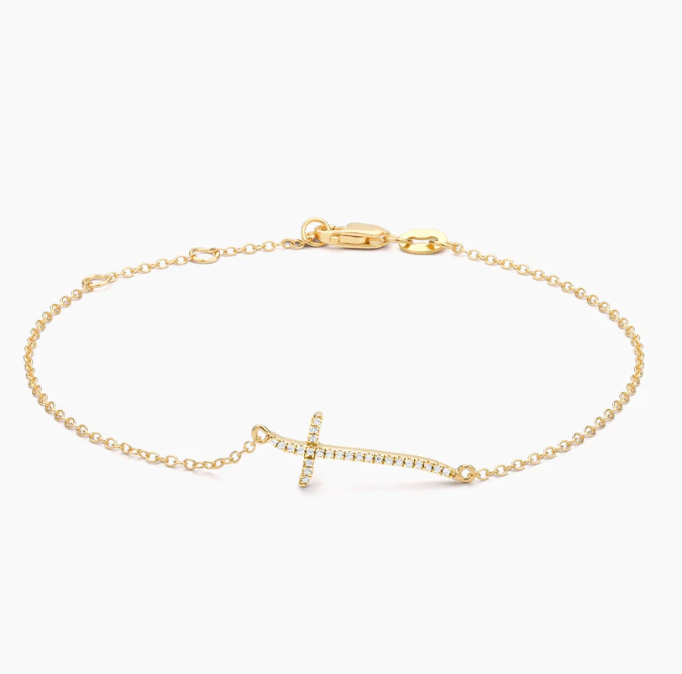 Ella Stein Criss Cross Chain Bracelet in gold — flat lay showing full cable chain length, pavé natural diamond sideways cross pendant, and lobster clasp closure.
