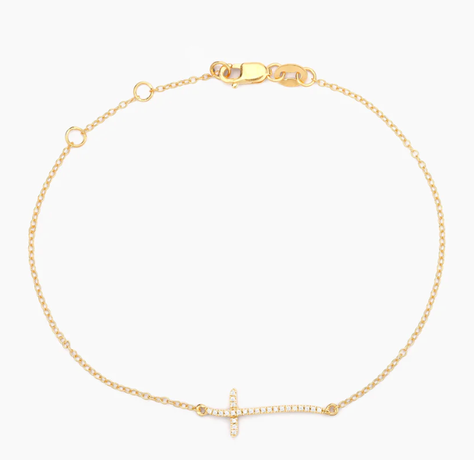 Ella Stein Criss Cross Chain Bracelet in gold — flat lay highlighting lobster clasp, extender chain, and full bracelet silhouette with sideways cross centered on cable chain.