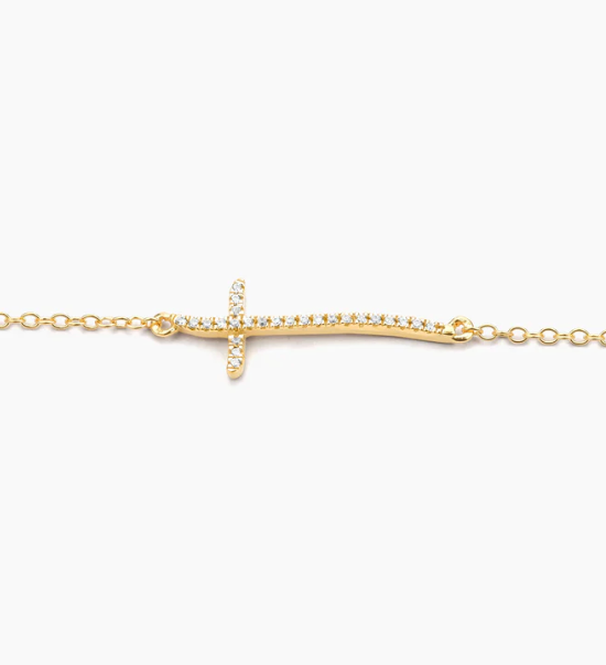 Ella Stein Criss Cross Chain Bracelet in gold — close-up of pavé natural diamond sideways cross pendant showing horizontal orientation, curved bar, and fine cable chain attachment points.