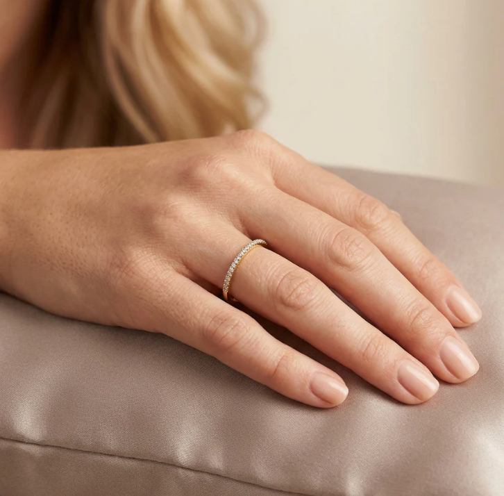 Ella Stein For All Eternity Stack Ring in gold — on-model hand shot showing ring scale on finger, pavé diamond upper face, and slim band width in gold plating.