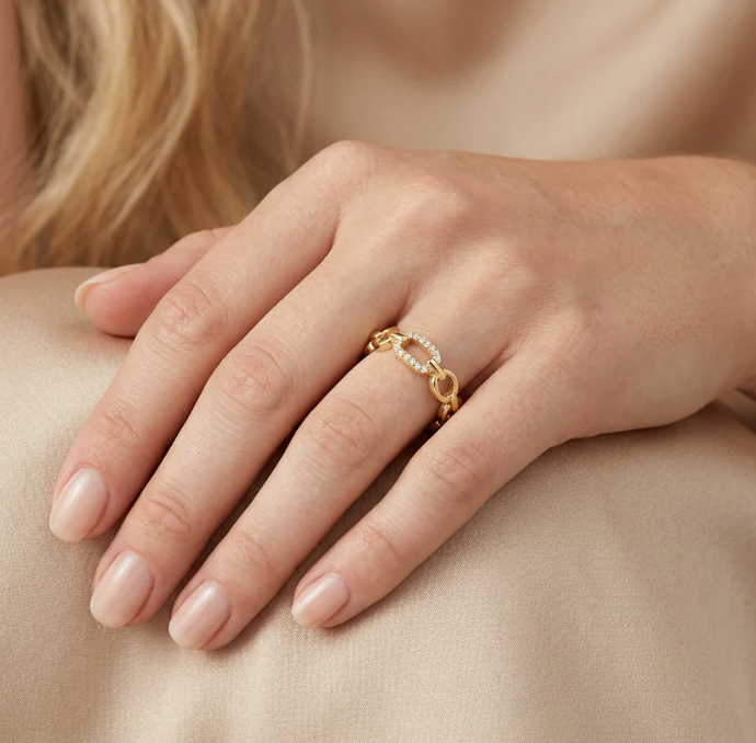 Ella Stein Linked Forever To You Stack Ring in gold — on-model hand showing ring scale on finger, curb chain link silhouette, and pavé diamond detail on alternating links.